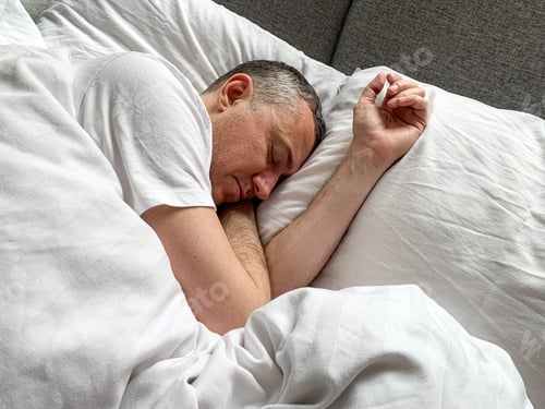 Preview: Middle aged adult man sleeping at home Cozy bedroom bed vibes white bedsheets Alone Early morning