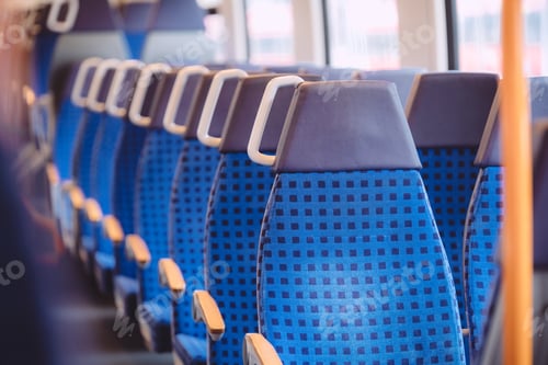 Preview: Bright blue seats in an empty train in Germany