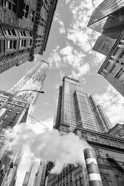 Preview: Looking up at Manhattan skyscrapers with steam pipe.