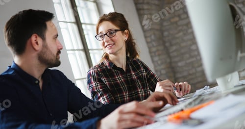 Preview: Portrait of young designers working on computer
