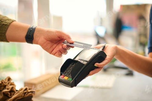 Preview: Close Up Of Customer In Store Making Contactless Payment With Credit Or Debit Card