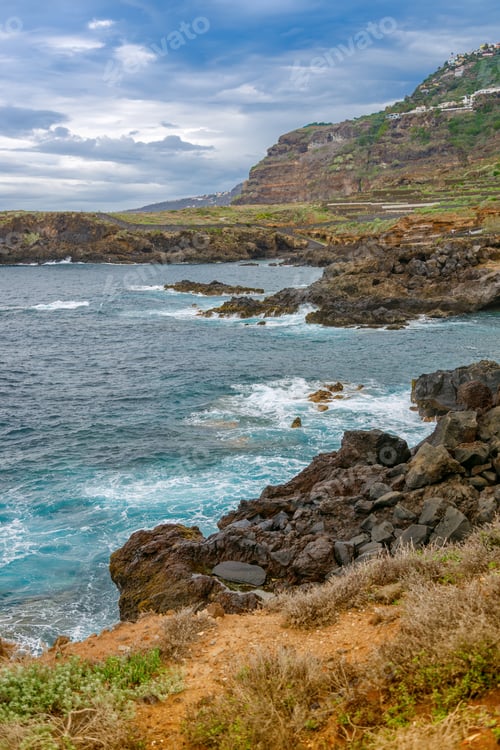 Preview: Rocky coastal landscape of El Sauzal, Tenerife, with dramatic cliffs and a vibrant ocean