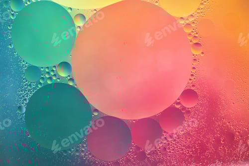 Preview: Abstract yellow, green and pink colorful background with oil on water surface. Oil drops in water
