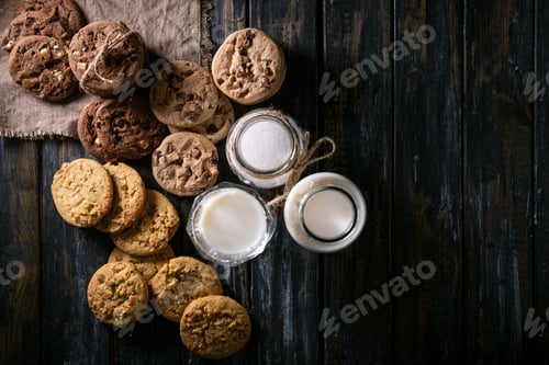Preview: Cookies and Milk on a Rustic Wooden Table