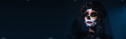 Preview: woman in traditional santa muerte makeup and black veil looking away on dark blue background, banner