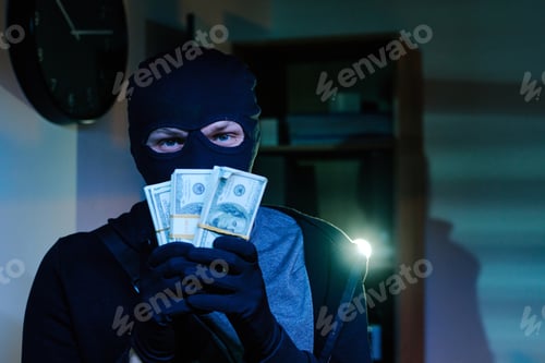 Preview: Young Adult Man Wearing Mask Stealing Money in Office at Night