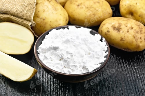 Preview: Starch potato in clay bowl on board