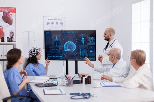 Preview: Neurologist man doctor checking brain expertise using headset with sensors on woman asisstant