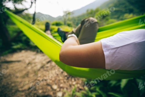 Preview: Relaxing in hammock in tropical forest
