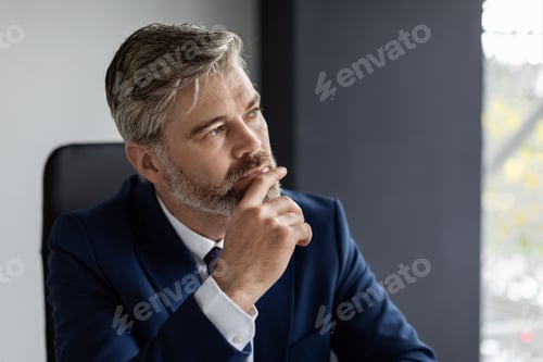 Preview: In Search Of Inspiration. Thoughtful Middle Aged Businessman At Workplace In Office