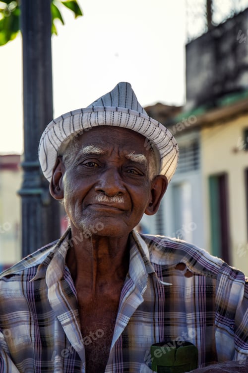 Preview: Vertical portrait of an elderly black man outdoors