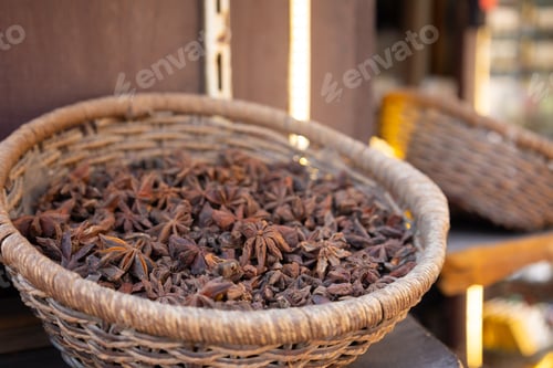 Preview: Traditional spices market. Pots and wooden tubs stand with star anise spice. Street bazaar. Dubai