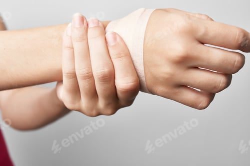 Preview: bandaged arm joint pain treatment medicine close-up