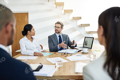 Preview: Cropped shot of a group of businesspeople meeting in the boardroom