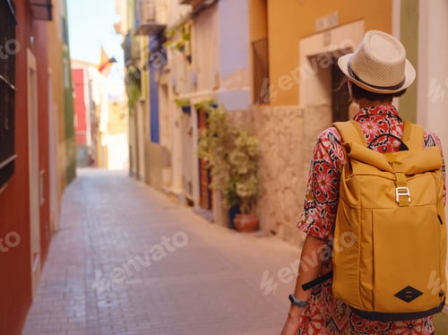 Preview: Woman strolls through colorful streets of Spanish coastal town