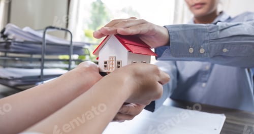 Preview: House model with agent and customer discussing for contract to buy, get insurance or loan real