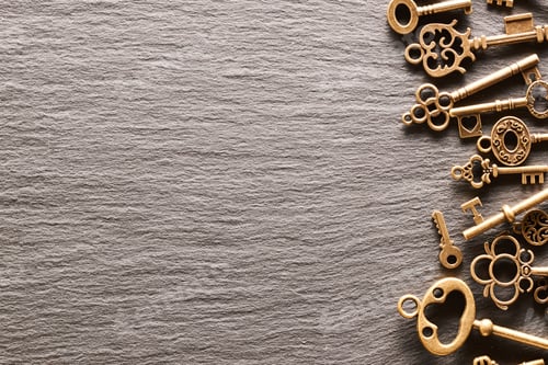 Preview: Various metal keys on slate background