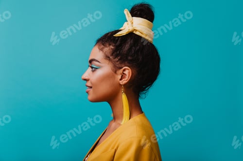 Preview: Young Woman Poses in Profile with Bright Makeup