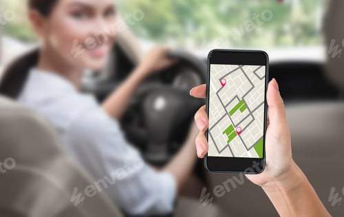 Preview: Female Hand Holding Smartphone With Navigation App In Car
