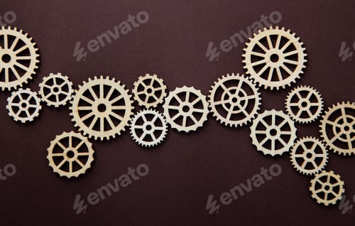 Preview: top view of wooden gears on brown background