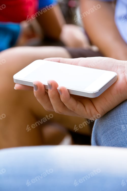 Preview: Close-up of a woman's hands holding and using a smartphone