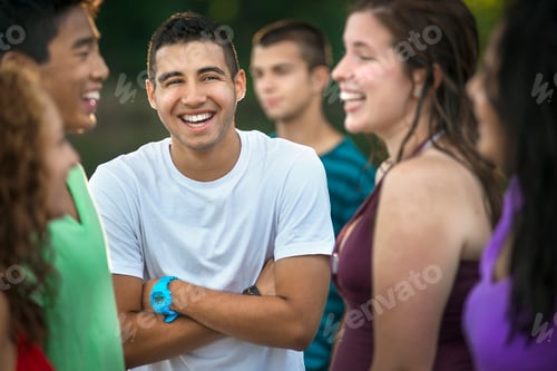 Preview: A group of young people, teenagers, friends laughing and joking.