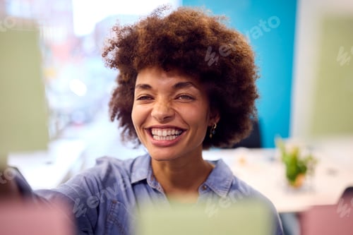 Preview: Young Businesswoman Working In Modern Office Looking At Transparent Screen With Sticky Notes