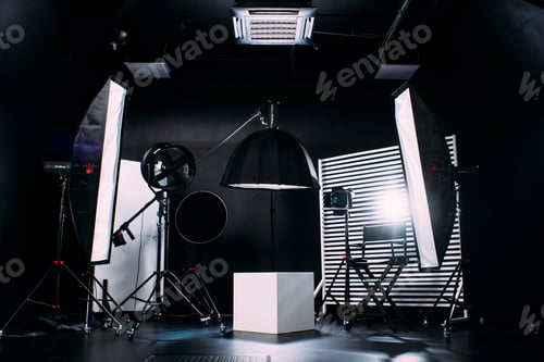 Preview: Modern photo studio with professional equipment. Black cyclorama.