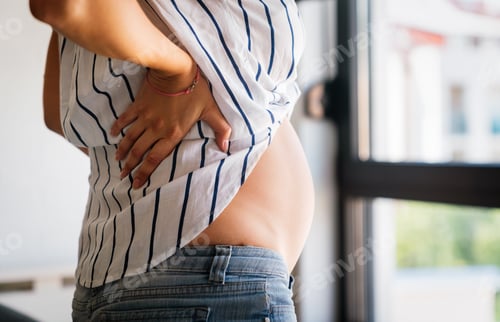 Preview: Pregnant woman expecting baby with aches, nausea, headache and backpain