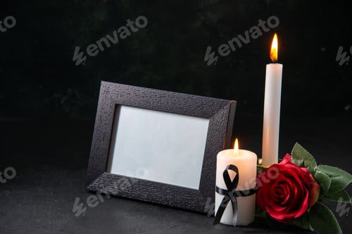 Preview: front view of burning candles with red flower on the dark background funeral death evil