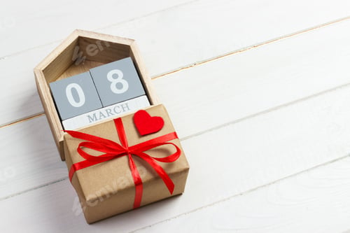 Preview: Women's Day background with handmade small textile heart, calendar and gift box