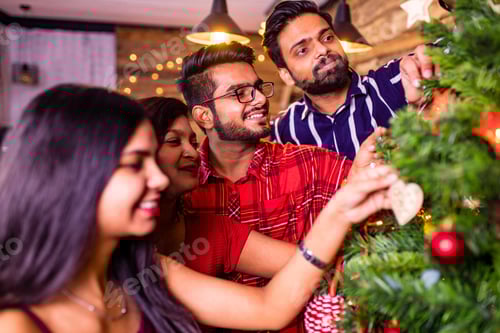 Preview: indian friends decorating the christmas tree self-isolation quarantine corona virus