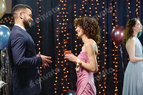 Preview: Young Caucasian Man Talking with Young Caucasian Woman at Formal Party
