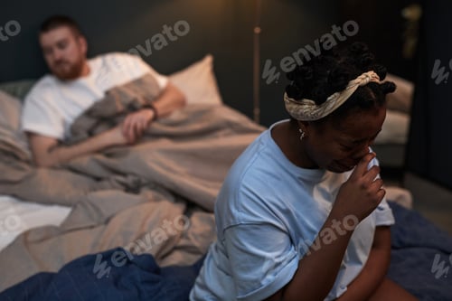 Preview: Caucasian Man Watching Black Woman Crying during Relationship Conflict