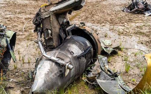 Preview: Crashed airplane scattered parts in the grassland