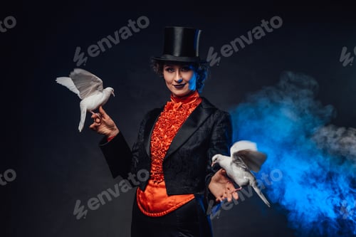 Preview: Mysterious circus actress holding two little doves on her hands in smoke