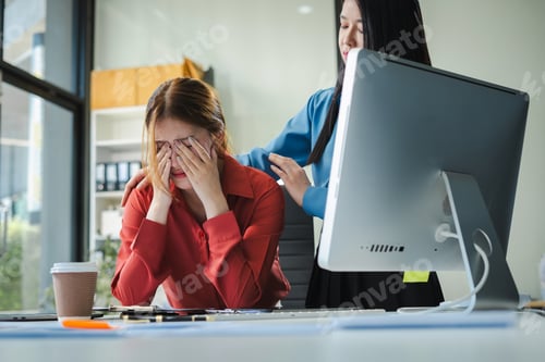 Preview: Stress businesswoman is sitting at table, under stress from working.