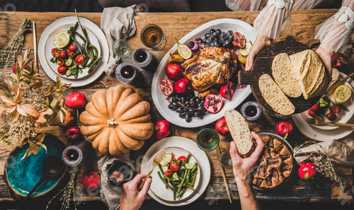 Preview: People eating festive dinner with roasted chicken on Thanksgiving day