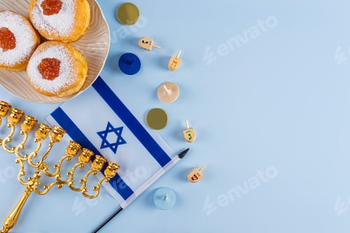 Preview: Traditional treats and symbols for the Jewish holiday of Hanukkah. Upper view. Blue background.