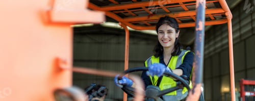 Preview: WoMan worker at forklift driver happy working in industry factory logistic ship.