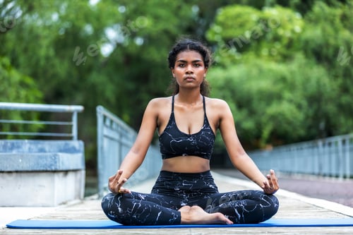 Preview: Woman doing yoga at outdoors garden. Woman is stretching in yoga at Garden. work out time