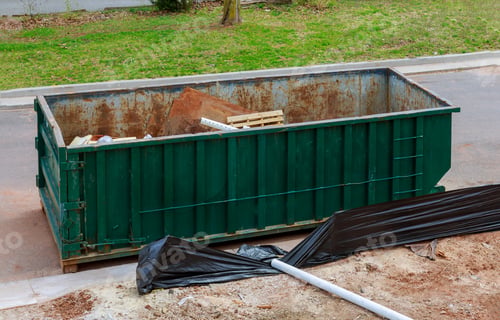 Preview: Old and used construction material in the new building frame of a new house under construction