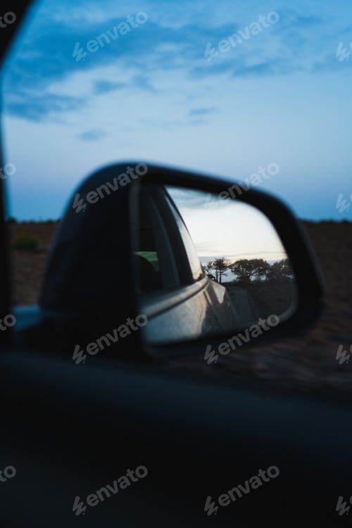 Preview: View in the cars rear view mirror on countryside road in Algarve, Portugal
