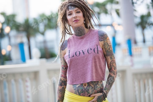 Preview: Beautiful hippie girl with tattoos and dreadlocks