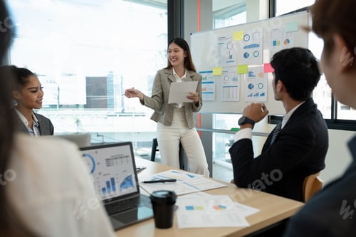 Preview: diverse business team people and female leader boss discuss financial result review paperwork share