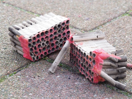 Preview: Close-up shot of used fire fireworks on the ground