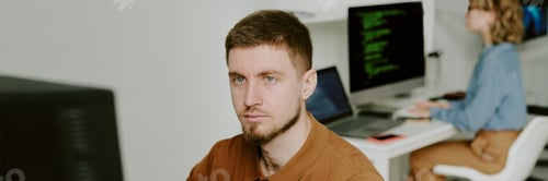 Preview: Young Male Programmer Focused on Work Website Banner