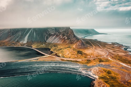 Preview: Eystrahorn headland or Krossasnesfjall mountain range with foggy covered among peninsula