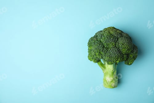 Preview: Fresh green broccoli on color background, top view. Space for text