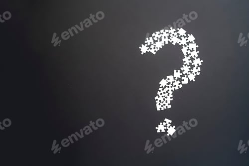 Preview: closeup puzze question mark on dark background isolated b